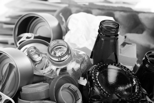 Hornsey Skip Hire vehicle arriving on site with branded skip and staff nearby